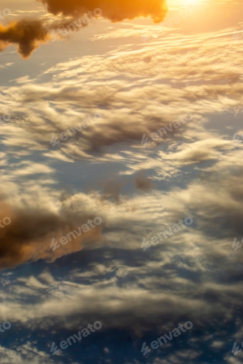 Preview: Vertical Image Of The Clouds On Sky With Sunlight.