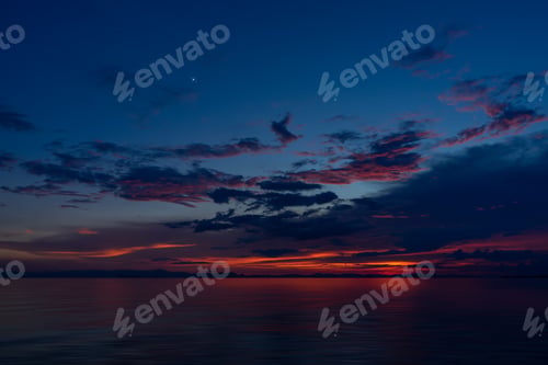 Preview: Beautiful Seascape Of Sunset Sky And Clouds Into The Twilight With First Star.