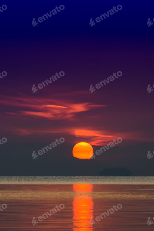 Preview: Big Sun And Orange Cloud In Sunset Sky On The Lake.