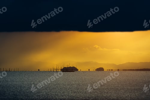 Preview: Clouds And Sunlight In The Sea At Golden Hour Sunset.