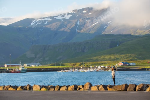 Preview: Asian Woman Looking At View Mountain In The Morning At Grundarfjordur City In Iceland. The