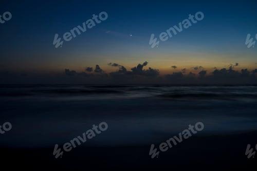 Preview: Long Exposure Of The Wave On The Beach Before Sunrise With Last Star.