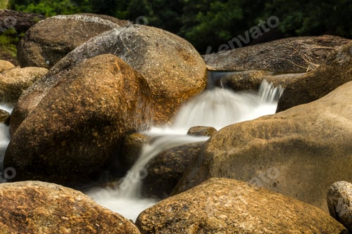 Preview: Small Waterfall And Rock In Tropical Forest. (Un-Focus Image)