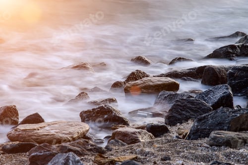 Preview: Long Exposure Of Misty Sea And Rocks On The Beach In The Morning.