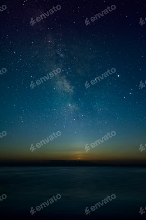 Preview: The Sky With Stardust At The Lake In The Twilight After Sunset With Noise And Grain.