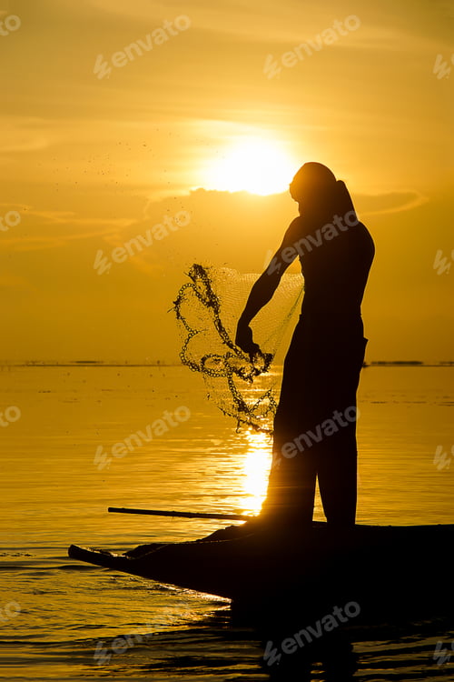 Preview: Silhouettes Fisherman Throwing Fishing Nets During Sunrise, Thailand.