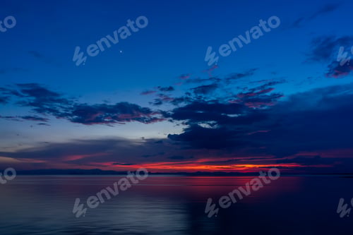 Preview: Beautiful Seascape After Sunset Sky And Clouds Into The Twilight With First Star.