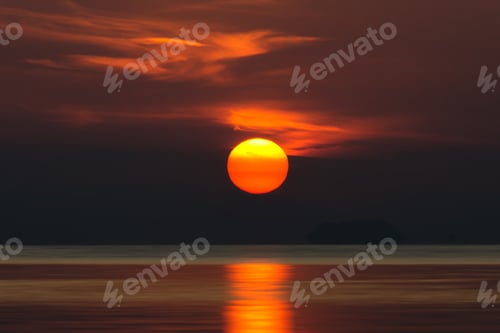 Preview: Big Sun And Orange Cloud In Sunset Sky On The Lake.