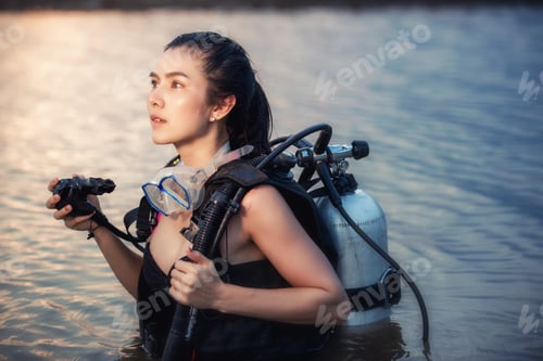 Preview: Sexy Female Scuba Diver In Full Equipment Goggles, Tank, Bcd, Reg, Fin, Stands On The River Ready