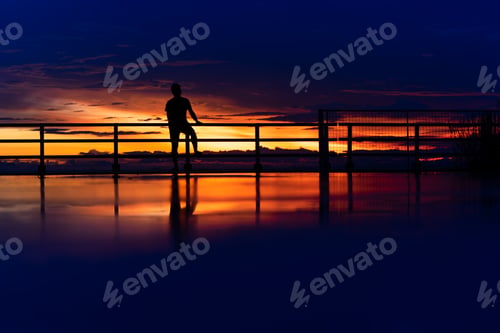 Preview: Blue Hour Photograph, Minimal Silhouette Of A Lonely Man Are Looking Sunset Sky With Reflection