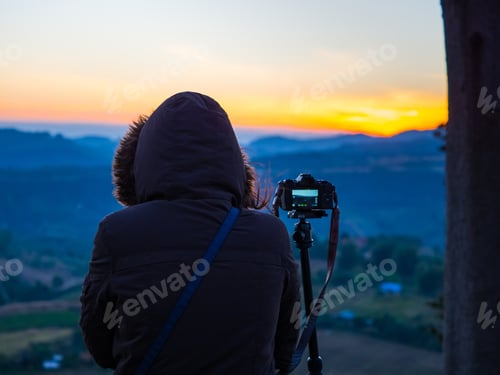 Preview: Travel And Photographer Concept From Backside Of Woman With Hoodie Cloth Stand And See Mountain