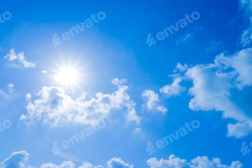 Preview: Blue Sky with Sunlight and Fluffy White Clouds