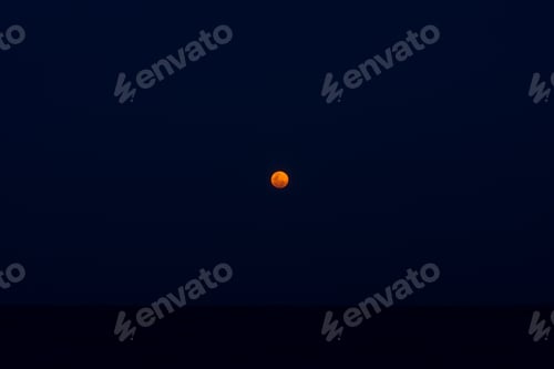 Preview: Small Blue Blood Lunar In The Dark Night At The Sea.