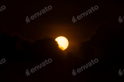 Preview: Big Sun On Dark Sunset Sky With Dark Clouds.