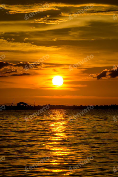 Preview: Beautiful Sunset At The Lake With Saturated Sky And Clouds. Idea: Un-Focus Image And Use For
