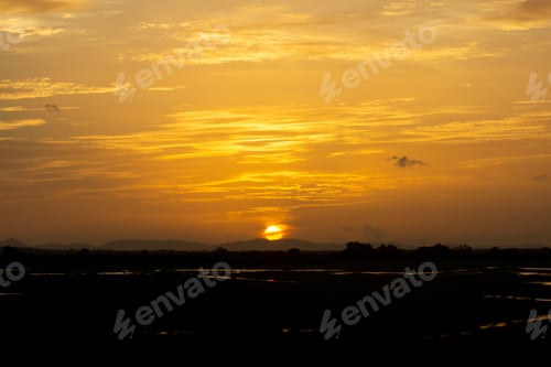 Preview: Silhouette Landscape Of Sunset Sky With Sun And Cloud. The Travel In Thailand.