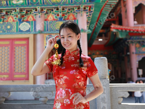 Preview: Cute Girl With Red Cheongsam , Asian Girl In Chinese Cheongsam Dress Holding Amulet
