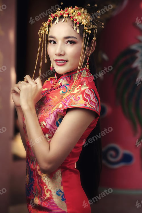 Preview: Beautiful Asian Woman In Chinese Dress Traditional With Congratulate Gesture In Chinese New Year
