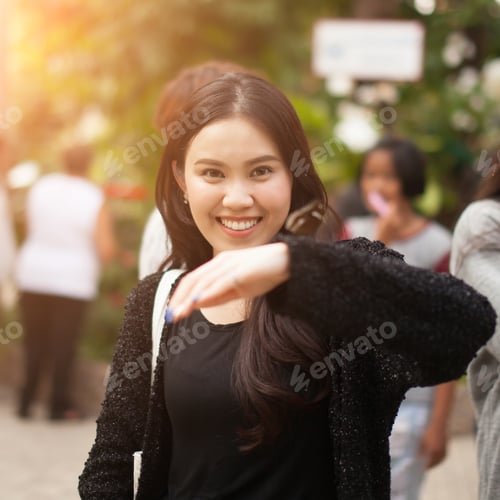 Preview: Woman Enjoying Butterfly Perched On Her Hand At The Park