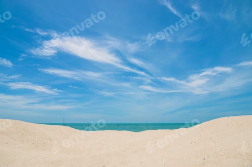 Preview: The Beach With A Blue Sky And Clouds.