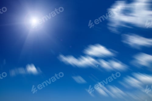 Preview: Motion Image Of White Cloud With Sun On Blue Sky.