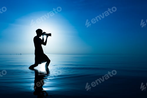 Preview: Black Shadow Of Photographer At The Lake In Blue Tone.