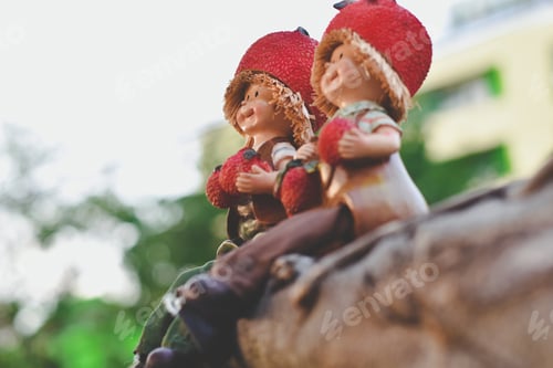 Preview: Two Dolls Sitting On A Wooden In The Beautiful Garden, Selective Focus, Valentine Lovers Concept.