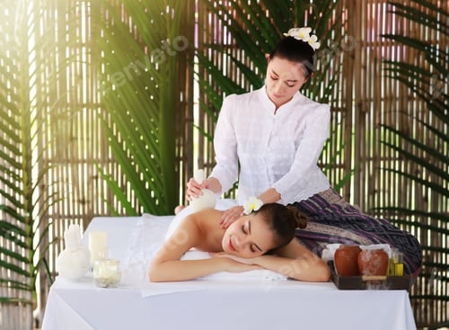 Preview: Young Beautiful Woman Getting Traditonal Spa And Massage Service In Bamboo Hut