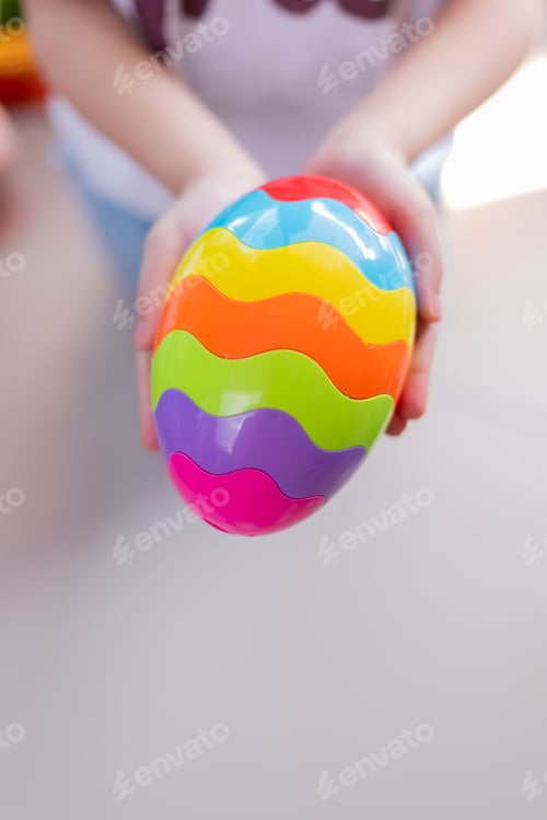 Preview: Happy Easter Day. Kid Hand With Colorful Egg Toy. Happy And Fun For Celebrate In April.