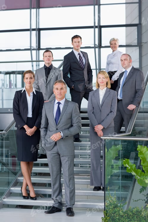 Preview: A Full-Length Vertical Portrait Of Confident Business People In Formal Suits While Standing On The