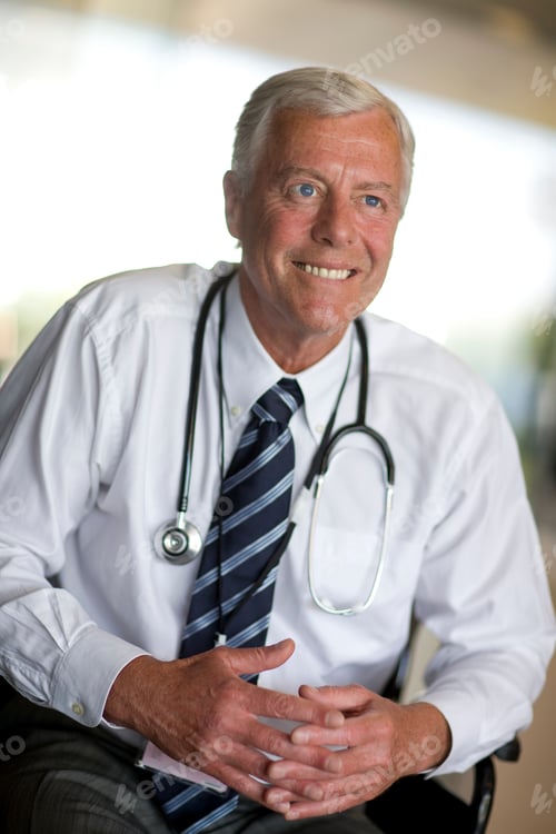 Preview: An Experienced Middle Aged Doctor With A Stethoscope Around His Neck Smiling In A Slant Vertical
