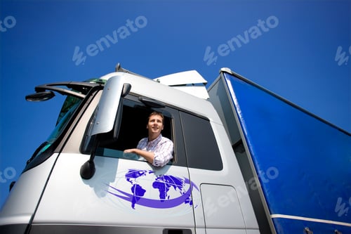 Preview: A Low Angle Shot Of A Truck Driver Looking Outside The Open Window Of A Semi-Truck With Bright Blue