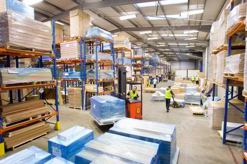 Preview: A Wide Shot Of Warehouse Workers Moving Pallets With Forklift.