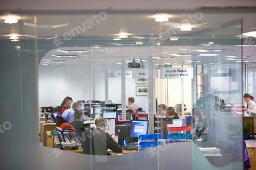 Preview: A Wide Shot Of A Sales Department Through The Glass Working In A Call Center.