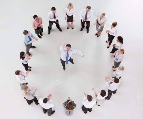 Preview: Overhead Shot Of A Jubilant Businessman Jumping In Air In Center Surrounded By His Cheering