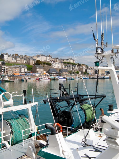 Preview: A Vertical Shot Of The Harbor Of Granville From A Fishing Boat In France With A Clear Blue Sky.
