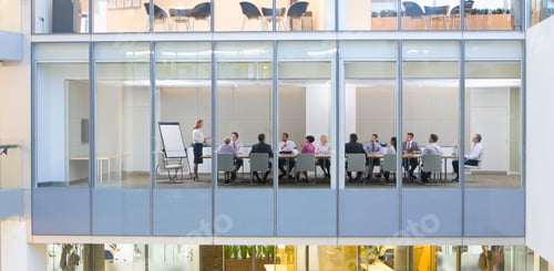 Preview: A Wide View Of Businesswomen And Businessmen Having An Important Meeting In A Conference Room Seen
