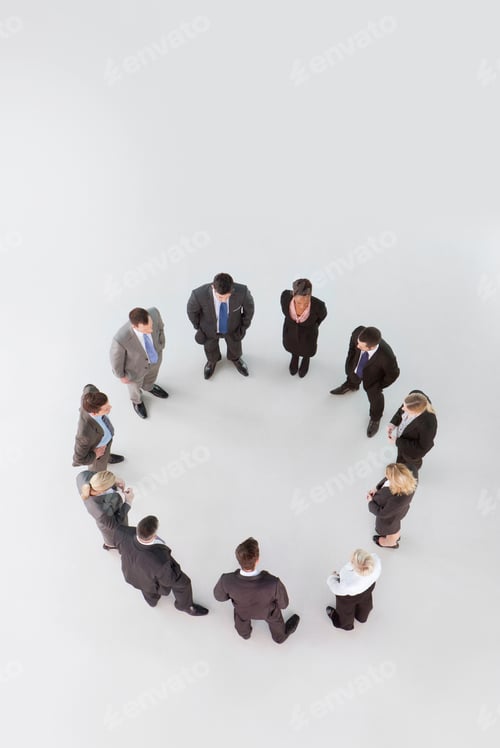 Preview: Overhead Shot Of A Group Of Businesspeople Standing In A Circular Formation.
