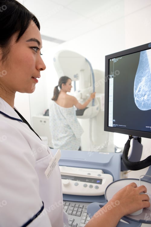 Preview: A Young Adult Radiologist Reviewing The Results Of Patient?S Mammogram On High Definition Monitor
