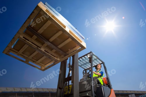 Preview: A Wide Low Angle Shot Of A Worker In Safety Vest Using Forklift To Move The Merchandise On A Sunny