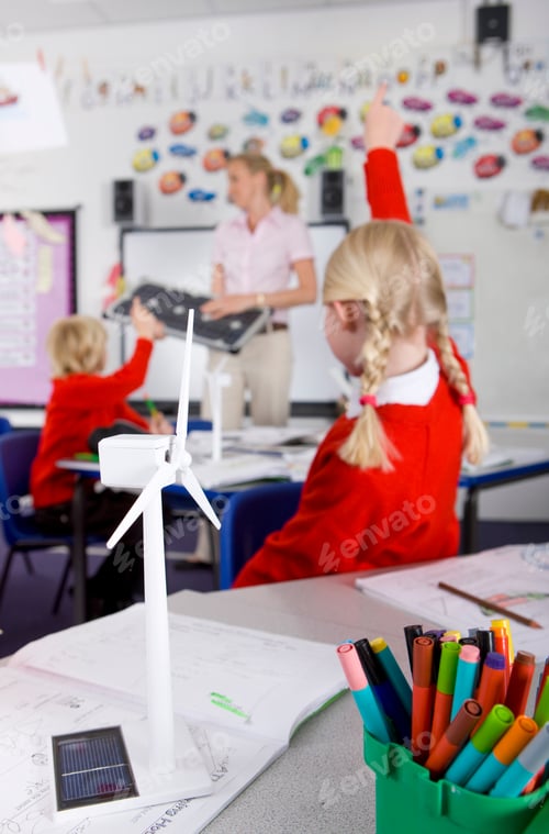 Preview: A Close Up Of Wind Turbine Model In Selective Focus With Teacher Explaining About Solar Panels To