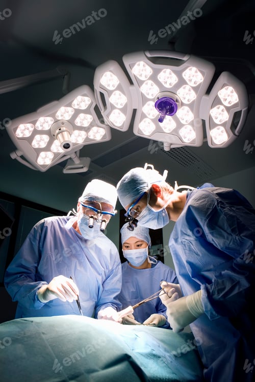 Preview: Surgeons Performing Operation in Brightly Lit Room