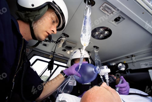 Preview: A Low Angle Closeup Of Paramedics Tending To A Patient On An Emergency Airlift Helicopter