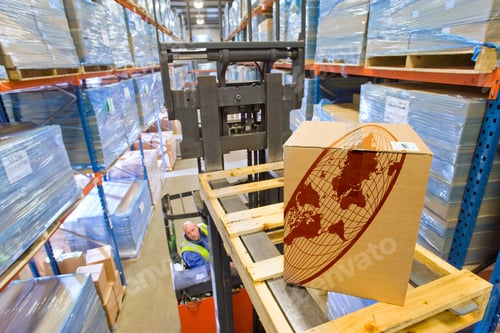 Preview: A Top Angle Shot Of A Warehouse Worker Moving A Cardboard Box With A Forklift.