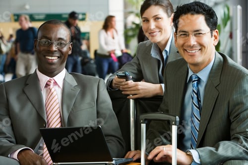 Preview: A Medium Shot Of An African - American Businessman Smiling At Camera While Sitting With A