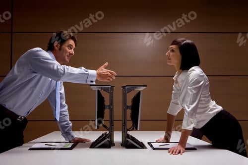 Preview: A Side Profile Shot Of A Businessman Extending Hand Towards A Businesswoman For A Handshake Over