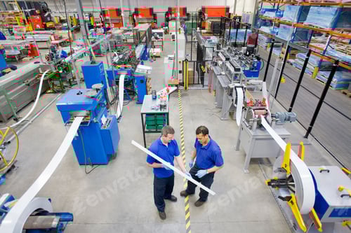 Preview: A Top Angle Wide Shot Of Workers Inspecting Aluminum Light Fitting In A Factory.