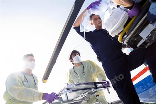 Preview: A Low Angle View Of Doctors And Paramedics Transferring Patient From An Emergency Airlift Helicopter