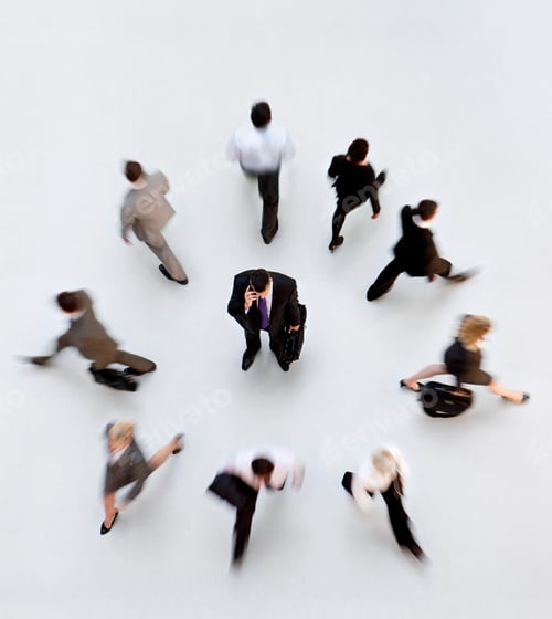 Preview: Overhead Shot Of Businesspeople In A Ring Walking Outwards With A Businessman Talking On A Cell
