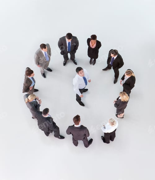 Preview: Overhead Shot Of A Group Of Businesspeople Standing In A Circular Formation With A Businessman In